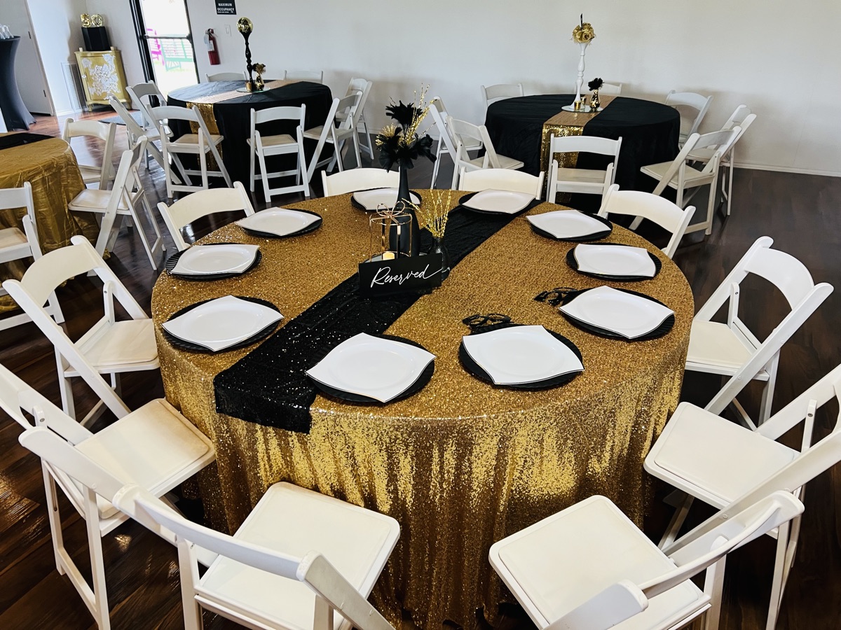 Black-and-gold formal table setup